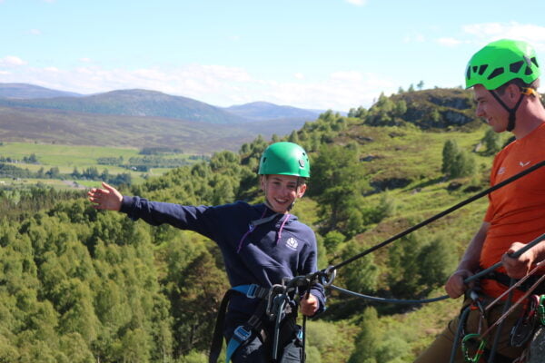 Happy abseiling kid