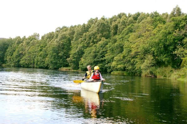 Two rowers in a canoe