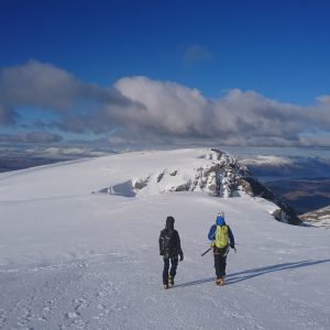 Walking off the summit of Ben Nevis in Winter