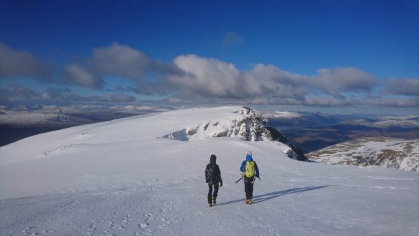 Walking off the summit of Ben Nevis in Winter