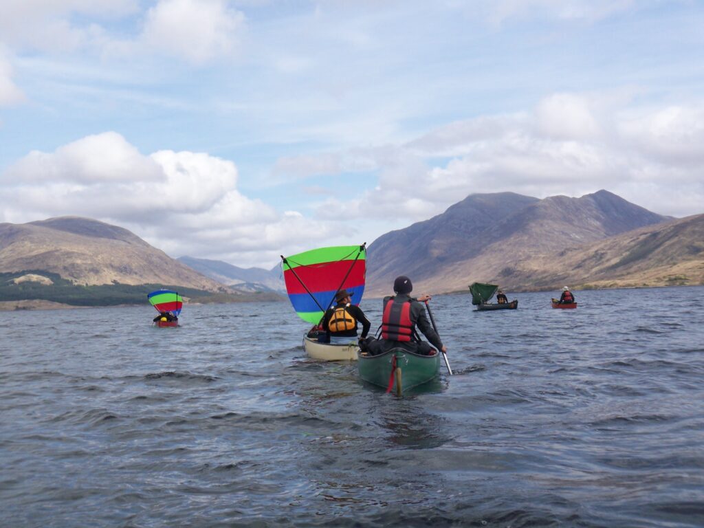A group on a canoeing holiday with Active Outdoor Pursuits