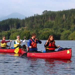 A group enjoying an Active Outdoor Pursuits Great Glen Way canoe holiday/journey.
