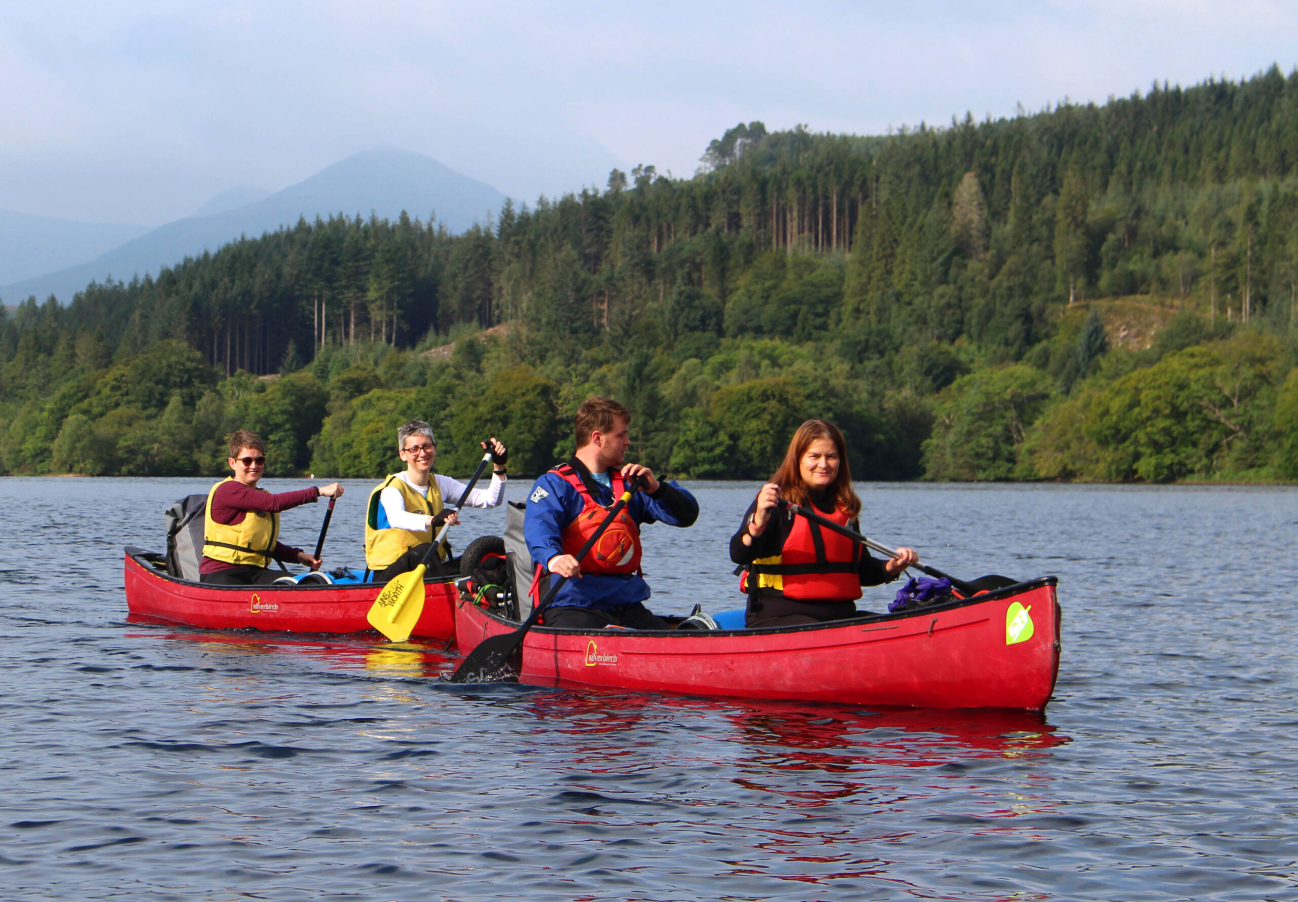 A group enjoying an Active Outdoor Pursuits Great Glen Way canoe holiday/journey.